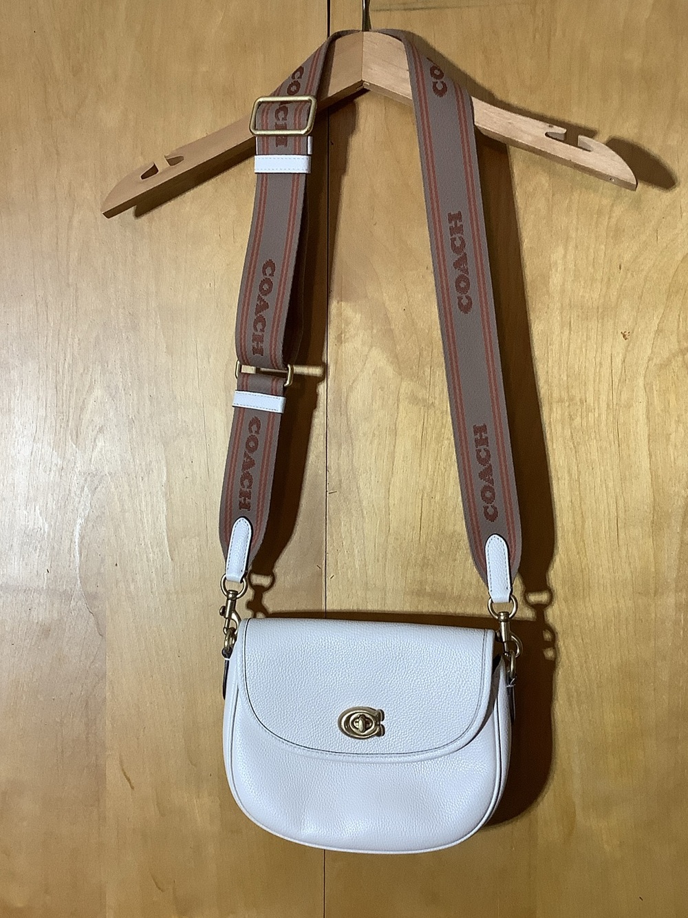 Coach Willow Saddle Bag with guitar style strap in chalk white